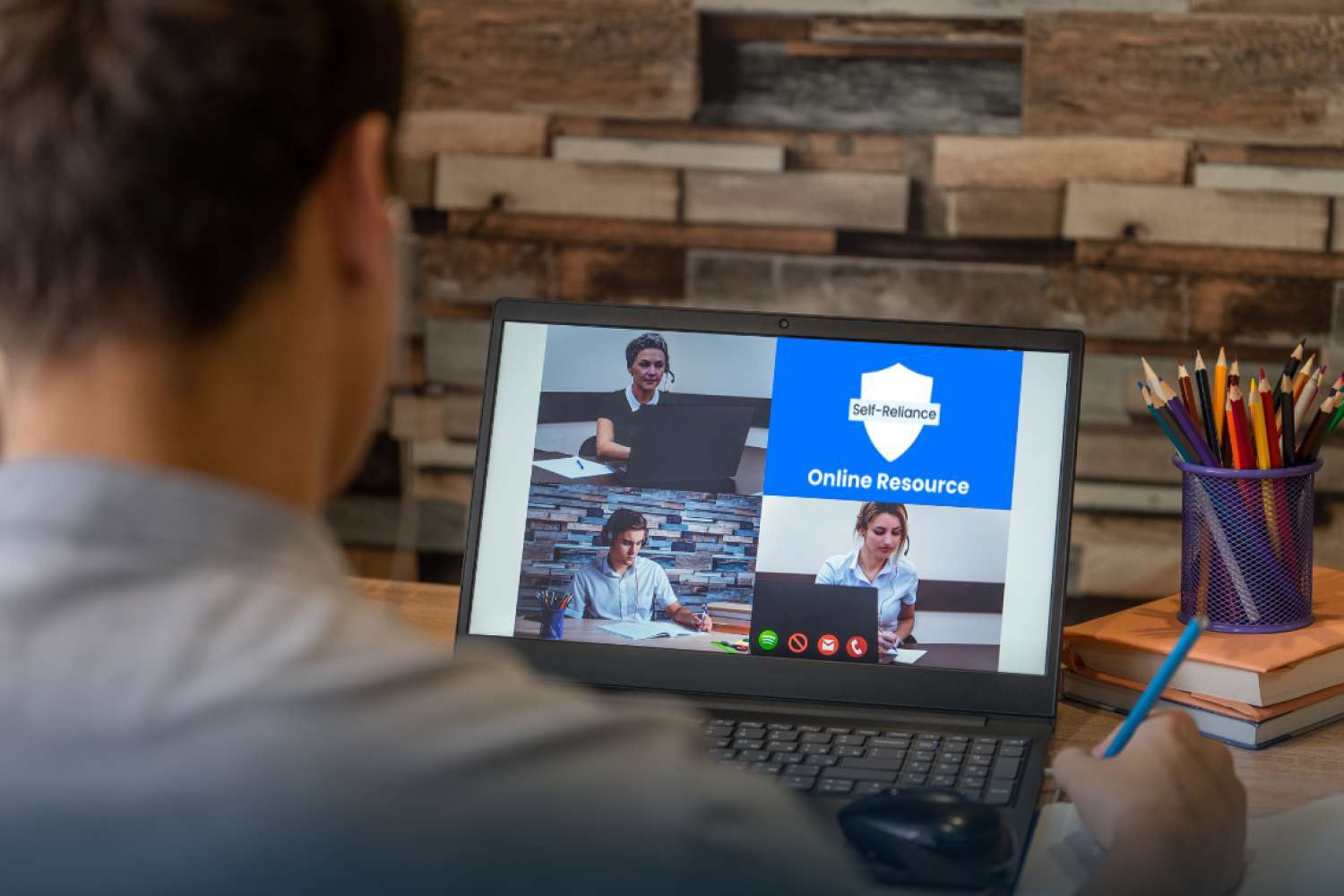 Person participating in an online learning session on a laptop, representing self-reliance education and digital training.