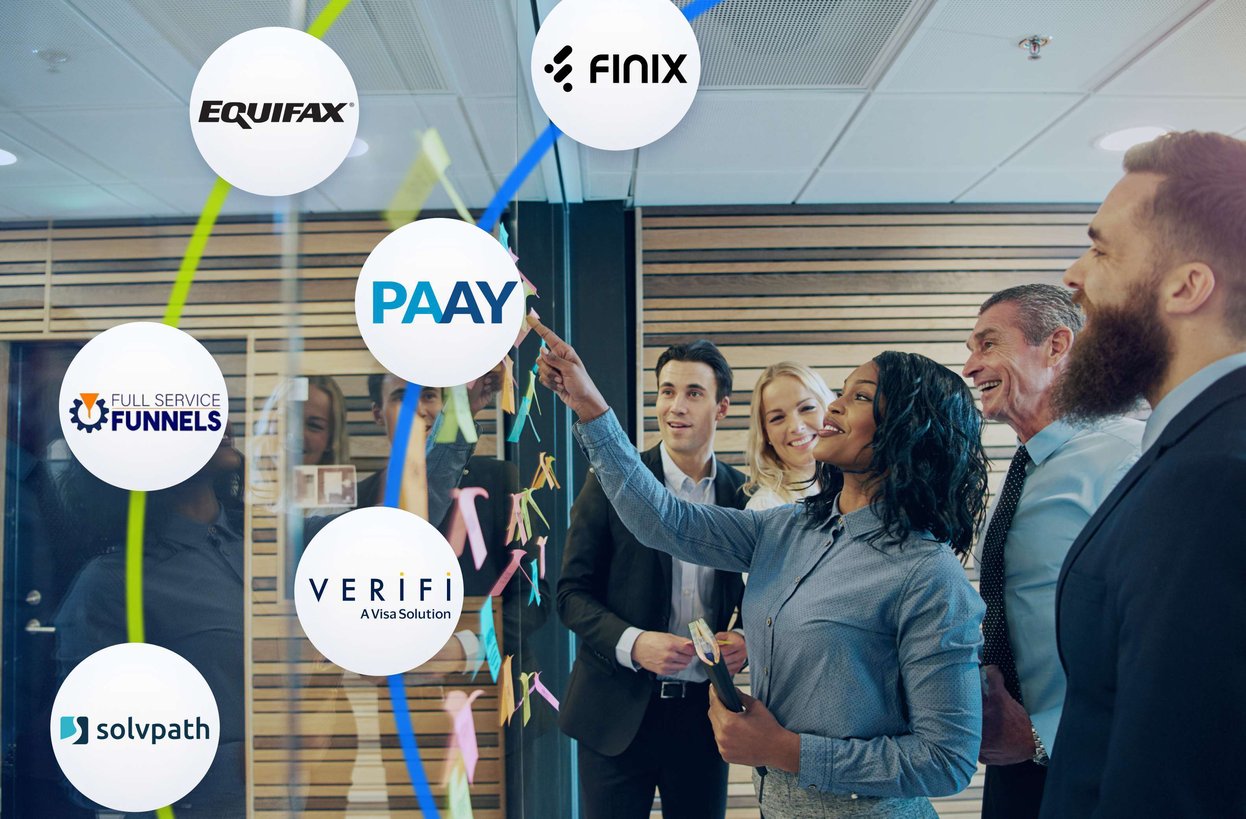 Group of business professionals collaborating at a glass board covered in sticky notes, with partner and affiliate logos including Kount, Finix, PAAY, Verifi, Full Service Funnels, and Solvpath displayed around them to represent strategic integrations and partnerships.