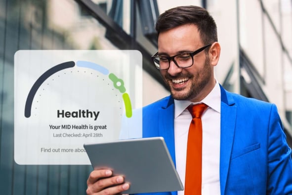 Merchant viewing a dashboard indicator showing healthy MID status and strong payment performance