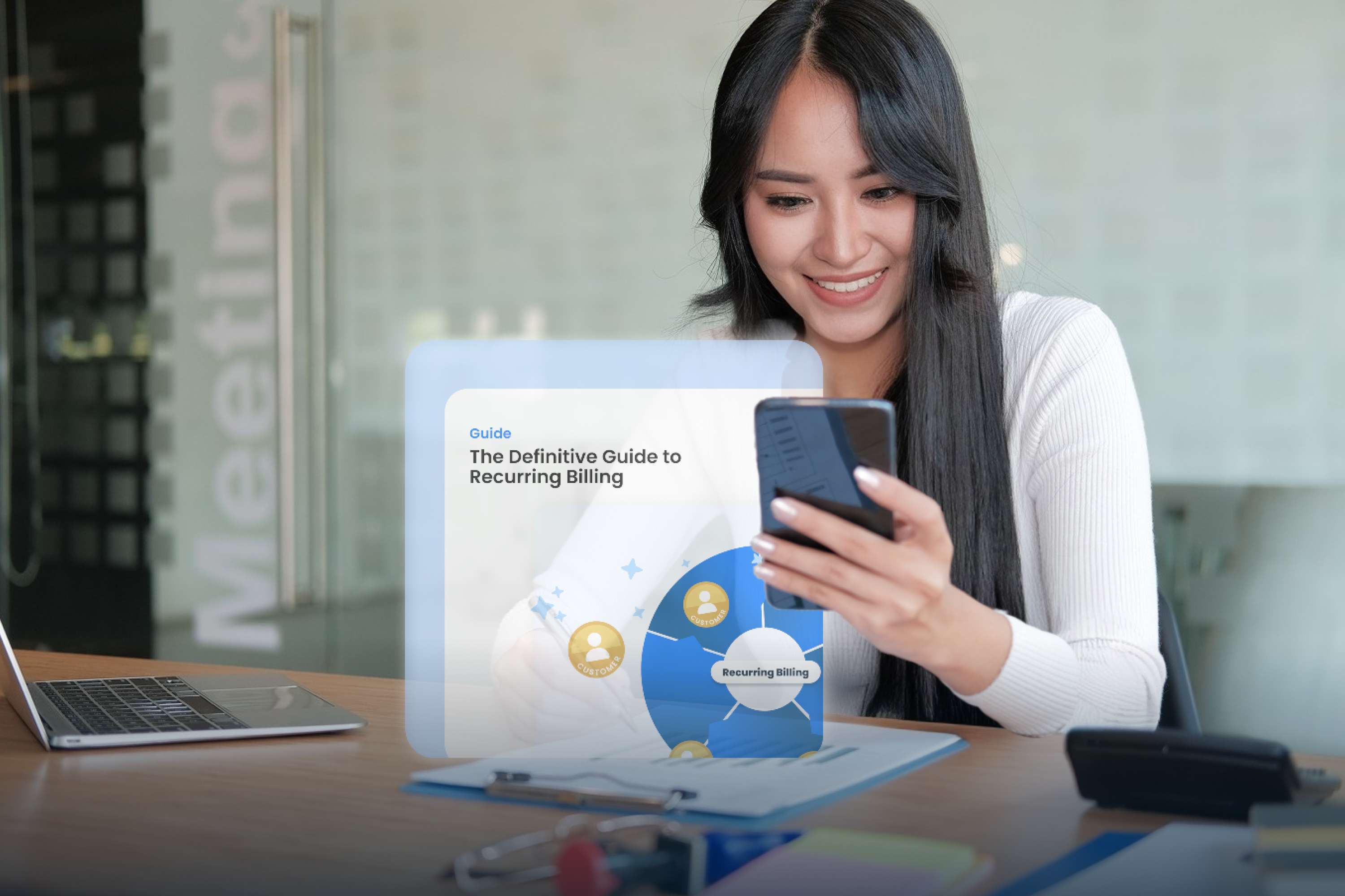 Smiling woman sitting at a desk using her smartphone, with a translucent overlay displaying a guide titled “The Definitive Guide to Recurring Billing” and a graphic illustrating recurring billing connections and customer icons